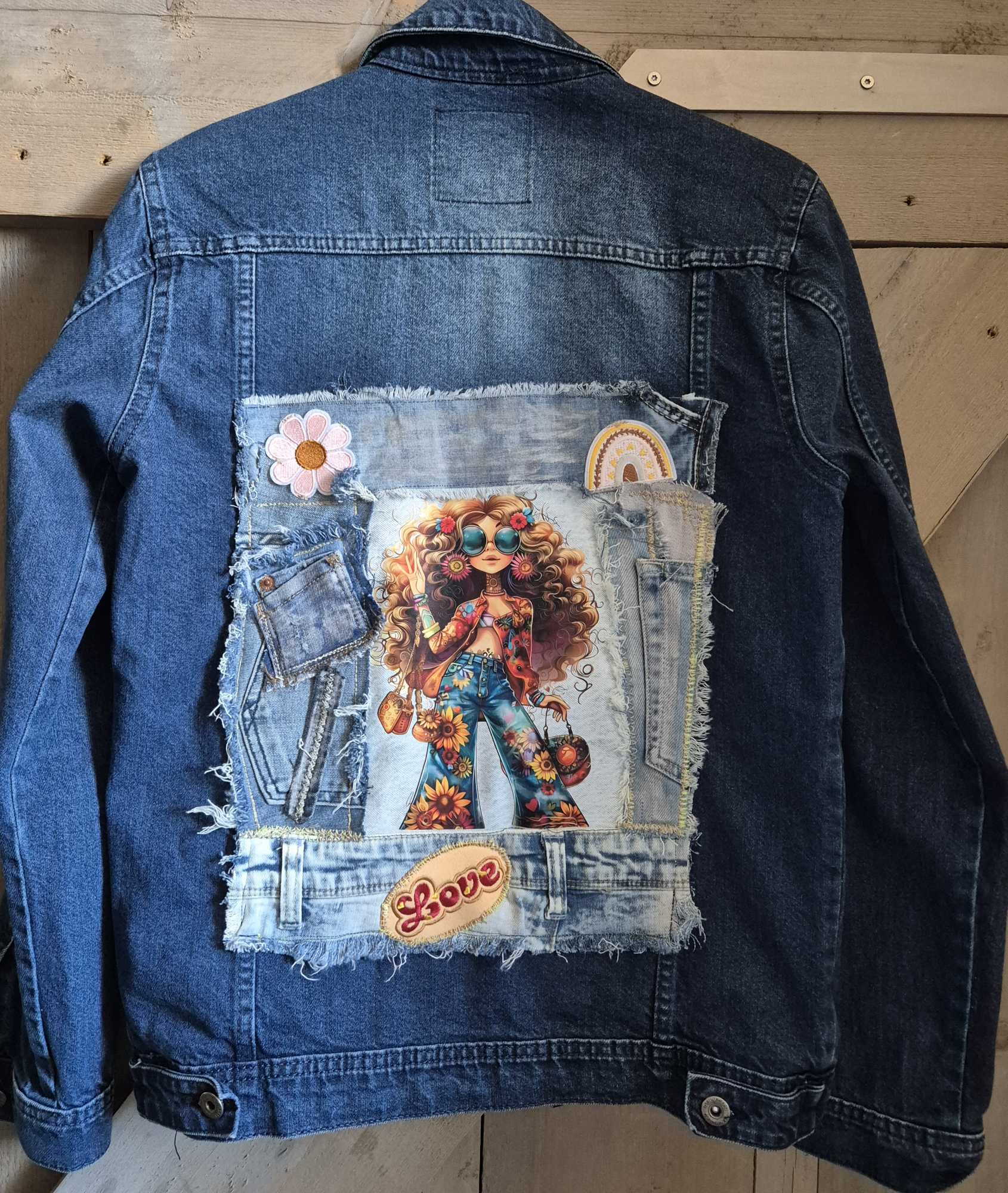 Front of upcycled denim jacket with patches and bohemian style details