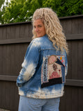 Strong & Free upcycled denim jasje gedragen 3/4 achterkant met handgemaakt rugkunstwerk