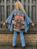 One of a Kind boho denim poncho met handgemaakte hippie kunstpatch 'It's a World Full of Princesses, Be a Hippie', gedragen van de achterkant door model – Old New Atelier.