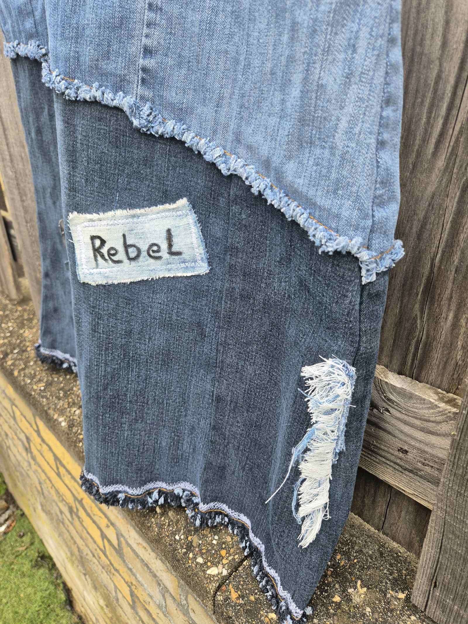 Detail upcycled denim rok rebel patch