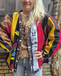 Voorkant van kleurrijke upcycled patchwork jas gedragen door model, boho stijl, handgemaakt en one of a kind ontwerp